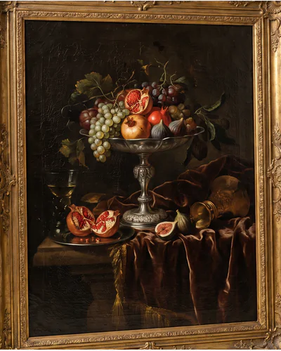 A dark Flemish still life of fruit, a silver tazza and drapery in a moulded gilt frame, photographed on a warm paper plate. — the tazza.